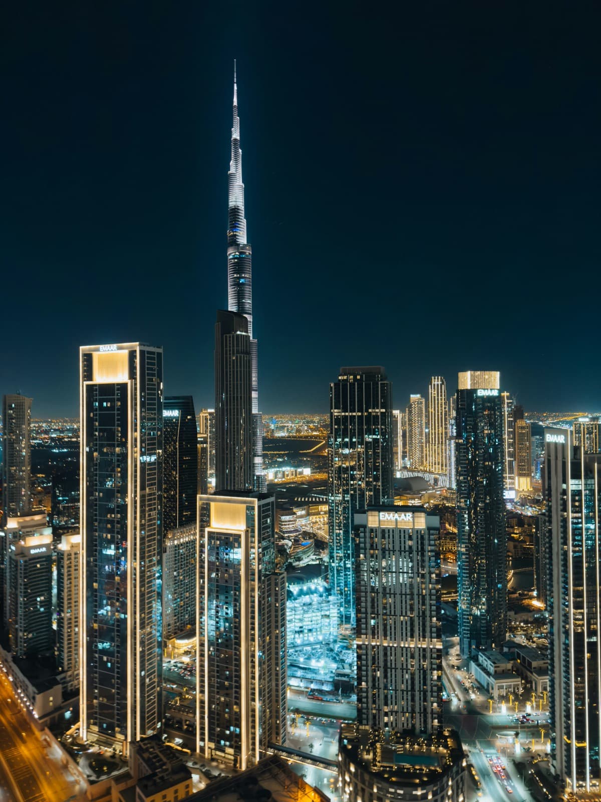 The Burj Khalifa rising over downtown Dubai lit up at night